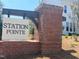 Attractive brick sign with white Station Pointe lettering welcomes you to this lovely community at 135 Willow Cameron Way, Angier, NC 27501