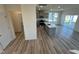 Open-concept kitchen with an island, stainless steel appliances, and hardwood floors at 135 Willow Cameron Way, Angier, NC 27501