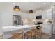 Modern kitchen with stainless steel appliances, white cabinetry, and a quartz countertop island at 135 Willow Cameron Way, Angier, NC 27501