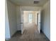 Hallway upstairs with neutral carpet, and doors leading to bedrooms at 135 Willow Cameron Way, Angier, NC 27501