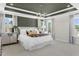 Large main bedroom features tray ceiling, great natural light, and stylish accent furniture at 135 Willow Cameron Way, Angier, NC 27501