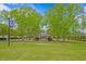 A gazebo sits in a well-manicured public park with mature trees and shrubs in Angier, North Carolina at 135 Willow Cameron Way, Angier, NC 27501