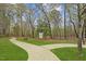Scenic community walking path with lush greenery, ideal for outdoor activities and recreation at 135 Willow Cameron Way, Angier, NC 27501