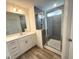 Stylish bathroom featuring a sleek, glass-enclosed tiled shower at 136 Willow Cameron Way, Angier, NC 27501