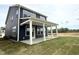 Exterior view of the home featuring a spacious covered porch with white columns and expansive views at 136 Willow Cameron Way, Angier, NC 27501