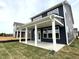 Inviting covered back porch with sturdy white columns and a view of the landscaped yard at 136 Willow Cameron Way, Angier, NC 27501