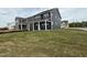 Picture of a new two-story home with a well-manicured lawn and spacious covered back porch at 136 Willow Cameron Way, Angier, NC 27501