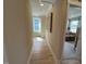 Upstairs hallway with hardwood flooring and natural lighting at 136 Willow Cameron Way, Angier, NC 27501