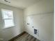 Bright laundry room featuring modern appliances and ample space at 136 Willow Cameron Way, Angier, NC 27501
