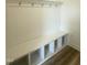 A mudroom with a coat rack, bench, and cubbies for storage at 136 Willow Cameron Way, Angier, NC 27501