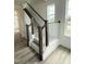 Carpeted staircase with dark stained posts and white railing at 136 Willow Cameron Way, Angier, NC 27501