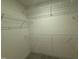 Walk-in closet with installed white shelving system at 136 Willow Cameron Way, Angier, NC 27501