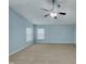 Spacious bedroom features neutral carpet, light blue walls, a ceiling fan, and great natural light at 151 N Great White Way, Clayton, NC 27527