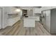 Bright and airy kitchen with stainless steel appliances and granite counters at 151 N Great White Way, Clayton, NC 27527