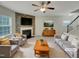 Inviting living room with a fireplace, comfortable seating, and stylish decor at 151 N Great White Way, Clayton, NC 27527