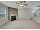 Spacious living room featuring a cozy fireplace and ample natural light at 151 N Great White Way, Clayton, NC 27527