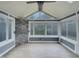 Beautiful sunroom with stone accents and multiple windows offering scenic views at 151 N Great White Way, Clayton, NC 27527