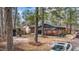 Exterior view of home with attached carport and cozy porch, complemented by a spacious yard at 1721 Fountain St, Rocky Mount, NC 27801