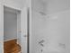 Bathroom featuring tiled shower with a large door, and neutral-colored walls at 1721 Fountain St, Rocky Mount, NC 27801