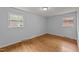 Bedroom with two windows that bring in plenty of natural light and hardwood floors at 1721 Fountain St, Rocky Mount, NC 27801
