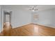 Bright bedroom with hardwood floors, ceiling fan, and neutral walls at 1721 Fountain St, Rocky Mount, NC 27801