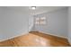 Bright bedroom with hardwood floors, neutral walls, and natural light at 1721 Fountain St, Rocky Mount, NC 27801