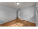 Hardwood floors extend through the bedroom with neutral paint and a closet at 1721 Fountain St, Rocky Mount, NC 27801