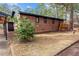 Charming brick home featuring an open porch with natural wood, set amongst a beautifully landscaped yard at 1721 Fountain St, Rocky Mount, NC 27801