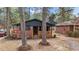 Charming brick home with a classic porch, accented by mature trees in a serene setting at 1721 Fountain St, Rocky Mount, NC 27801