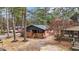 Charming brick home with a cozy front porch, surrounded by mature trees in a quiet neighborhood at 1721 Fountain St, Rocky Mount, NC 27801