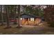 Charming brick home with a cozy porch and natural wood accents nestled among tall, mature trees at 1721 Fountain St, Rocky Mount, NC 27801