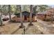 Charming brick home with a cozy front porch and mature trees in a quiet neighborhood at 1721 Fountain St, Rocky Mount, NC 27801
