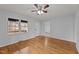 Sunlit living room featuring hardwood floors, neutral walls and ceiling fan at 1721 Fountain St, Rocky Mount, NC 27801