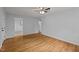 Bright living room featuring hardwood floors, neutral walls and ceiling fan at 1721 Fountain St, Rocky Mount, NC 27801
