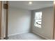 Bright, carpeted bedroom with window at 2005 Sequoia Ln, Durham, NC 27703