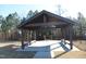 Beautifully constructed wooden pavilion surrounded by mature trees at 2100 Curry Meadow Way, Durham, NC 27703