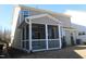 Rear exterior of home featuring a screened porch at 2100 Curry Meadow Way, Durham, NC 27703