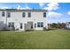 Backyard view of a home with newly installed sod at 212 Starlight St, Sanford, NC 27330