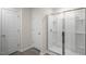 Bathroom featuring a glass enclosed shower and white painted doors at 212 Starlight St, Sanford, NC 27330