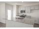 Contemporary kitchen with stainless steel appliances, gray cabinets and granite countertops at 212 Starlight St, Sanford, NC 27330