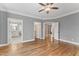 Main bedroom with en suite bathroom access, hardwood floors and natural light at 215 W Delafield Ave, Durham, NC 27704