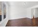 Bright bedroom with beautiful hardwood floors and a connected bathroom at 2415 Roanoke St, Durham, NC 27704