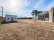 Vast backyard showcases a shed, open space, and the rear of a brick home with a white deck at 2420 New Bethel Church Rd, Garner, NC 27529
