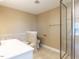 Bathroom featuring a shower, toilet, and vanity with sink, neutral tones and tile flooring at 2420 New Bethel Church Rd, Garner, NC 27529