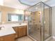 Bathroom featuring a large, glass-enclosed shower and double sink vanity with tile flooring at 2420 New Bethel Church Rd, Garner, NC 27529