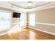 Bedroom featuring hardwood floors, a ceiling fan, and windows providing ample light at 2420 New Bethel Church Rd, Garner, NC 27529