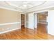 Bedroom showcasing a ceiling fan, hardwood floors, multiple doorways to adjacent rooms at 2420 New Bethel Church Rd, Garner, NC 27529