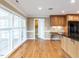Kitchen with hardwood flooring, stainless steel appliances, breakfast bar and natural light at 2420 New Bethel Church Rd, Garner, NC 27529