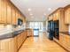Spacious kitchen with wood cabinets, granite counters, and stainless steel appliances at 2420 New Bethel Church Rd, Garner, NC 27529