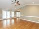 Bright and airy living room with hardwood floors, transom windows and neutral paint, perfect for entertaining at 2420 New Bethel Church Rd, Garner, NC 27529